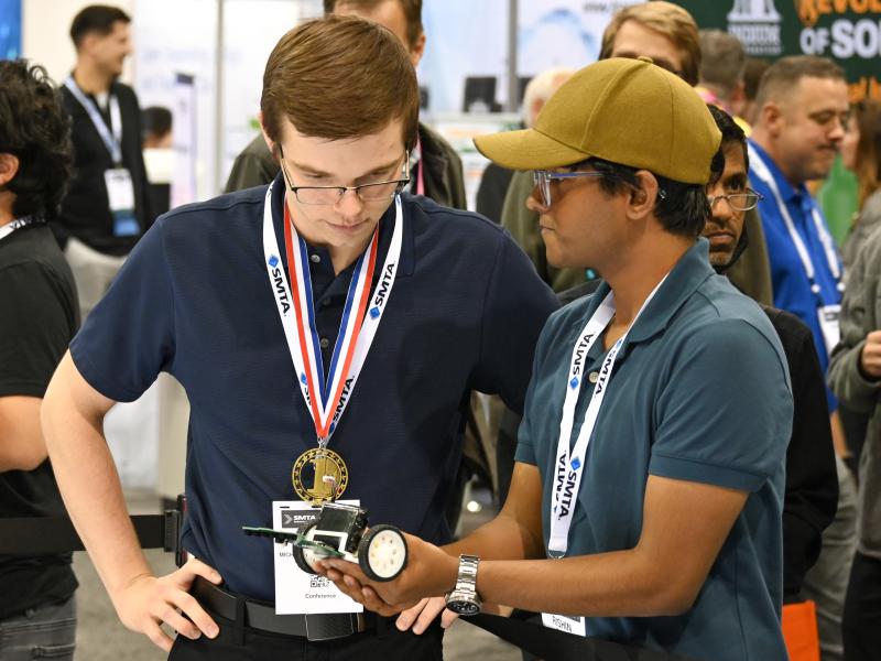 Students talking about robot