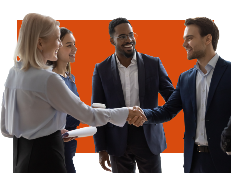 People shaking hands in front of others