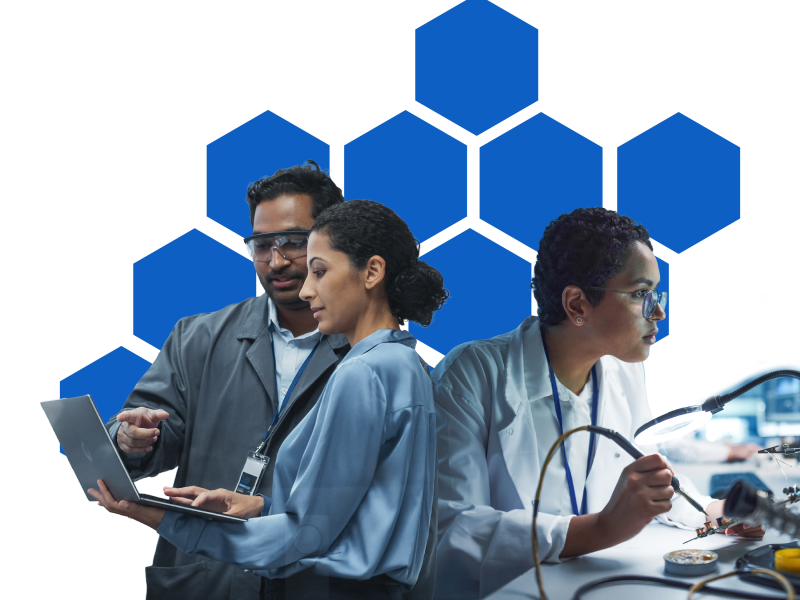 Industry professionals working on soldering and on computers