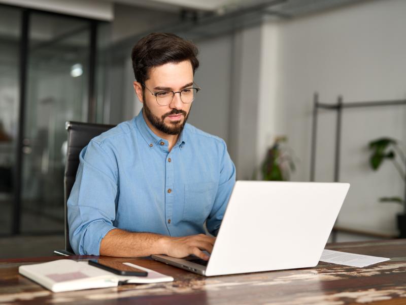 Professional man typing on computer
