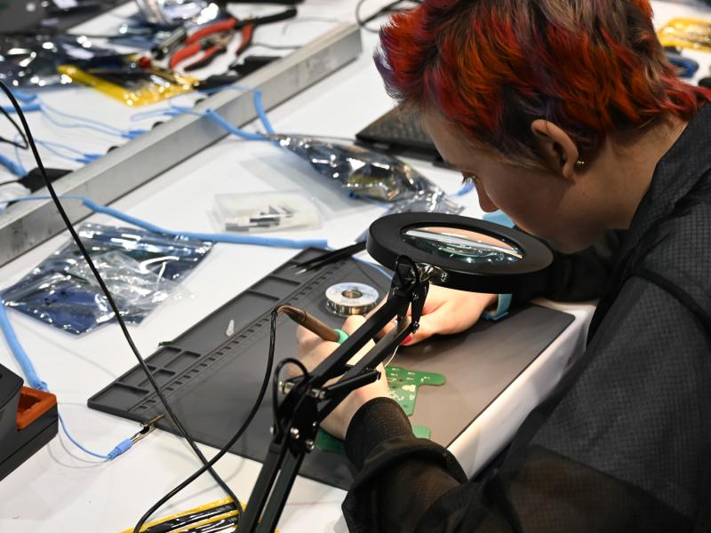 Student Soldering a Printed Circuit Board
