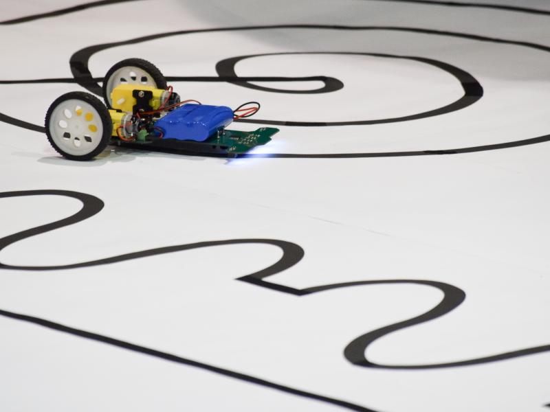 Small robotic car driving on line