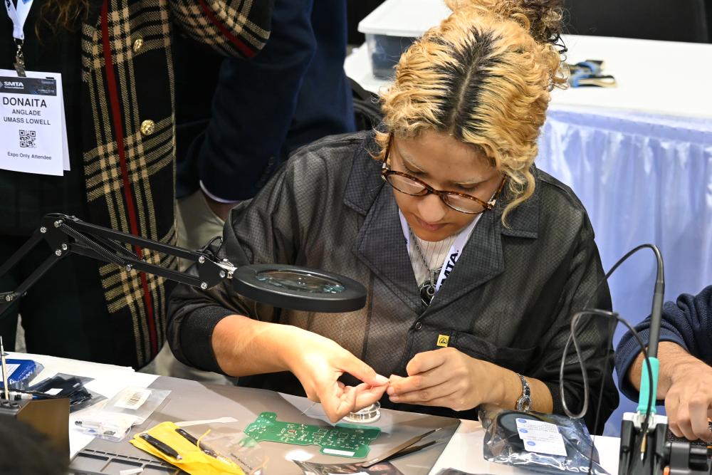 Human soldering parts to a PCB board