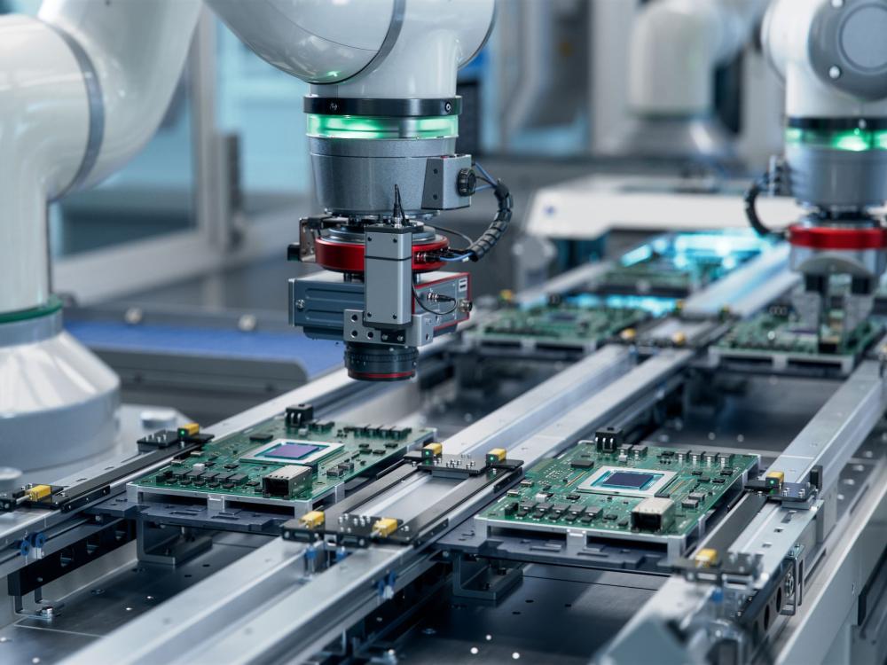 Robotic arm working on a circuit board